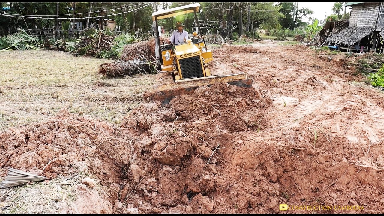 Mitsubishi Bulldozer BD2G Constructs New Road In The Small Village And Bulldozer Working first day