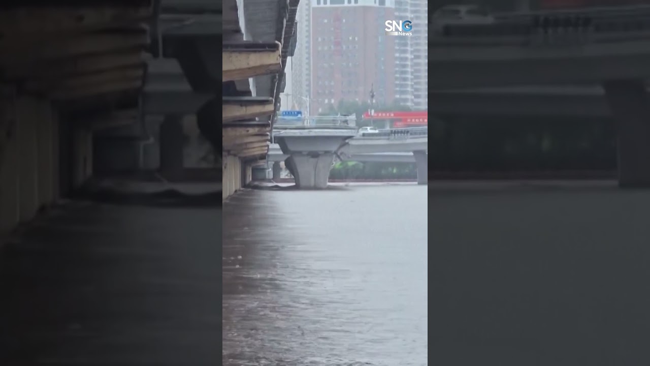 Floating lighthouse crashes into power lines, floats down river during Typhoon Bavi floods in China