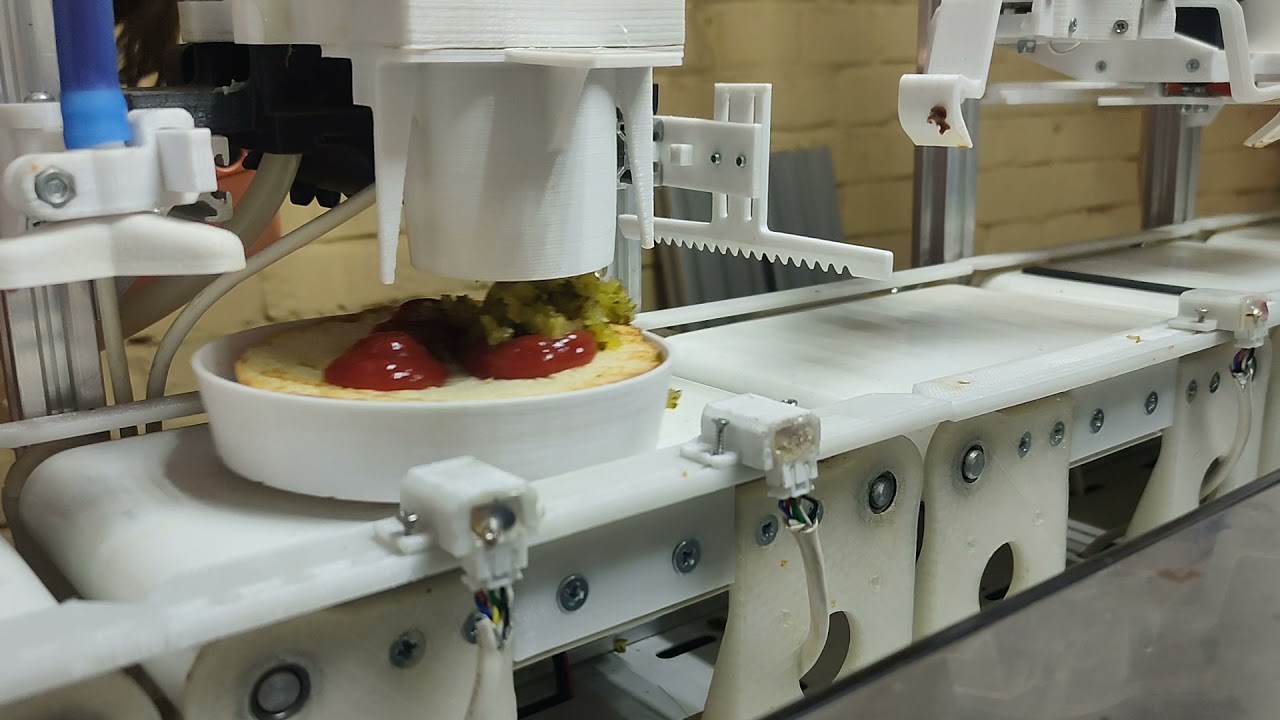 Robot from Russia is cooking burger
