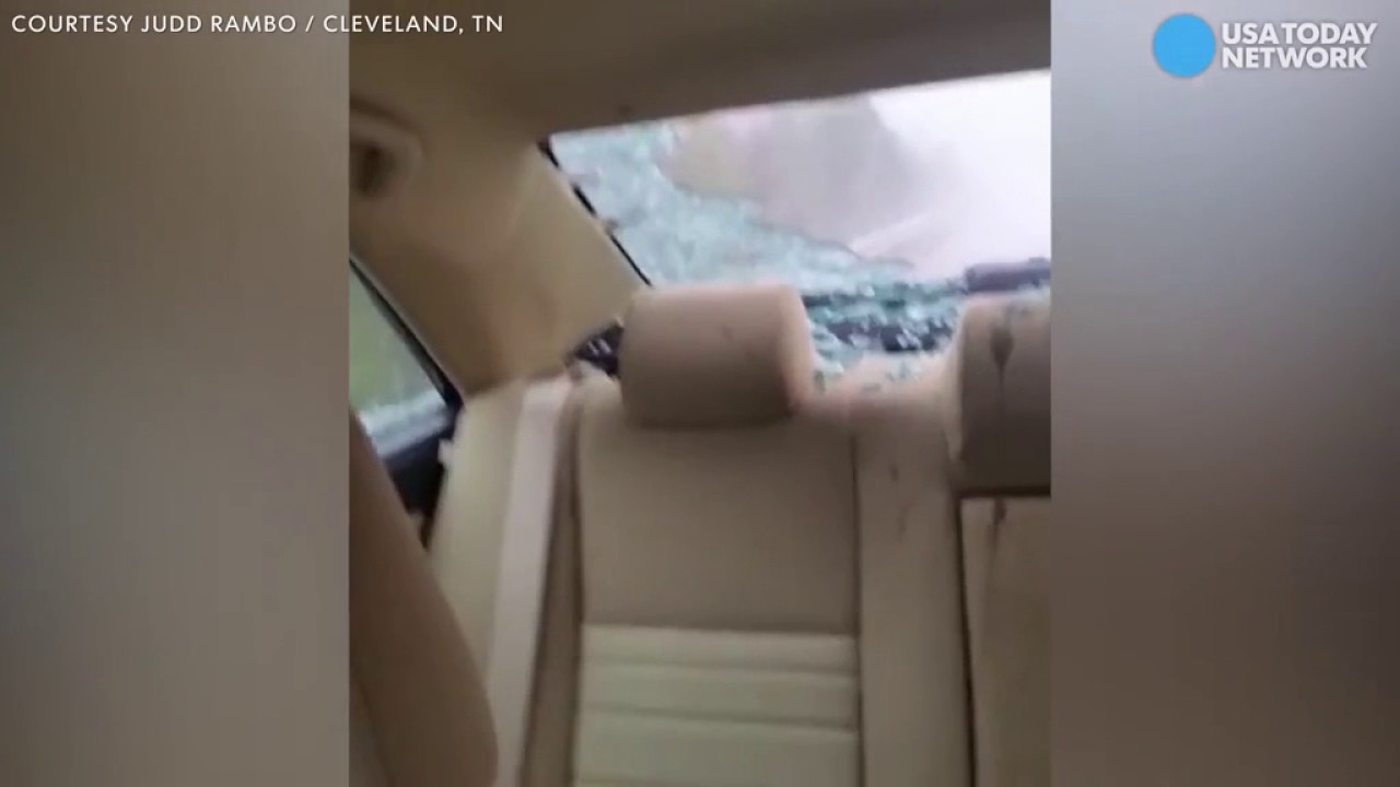 Hail completely smashes car window