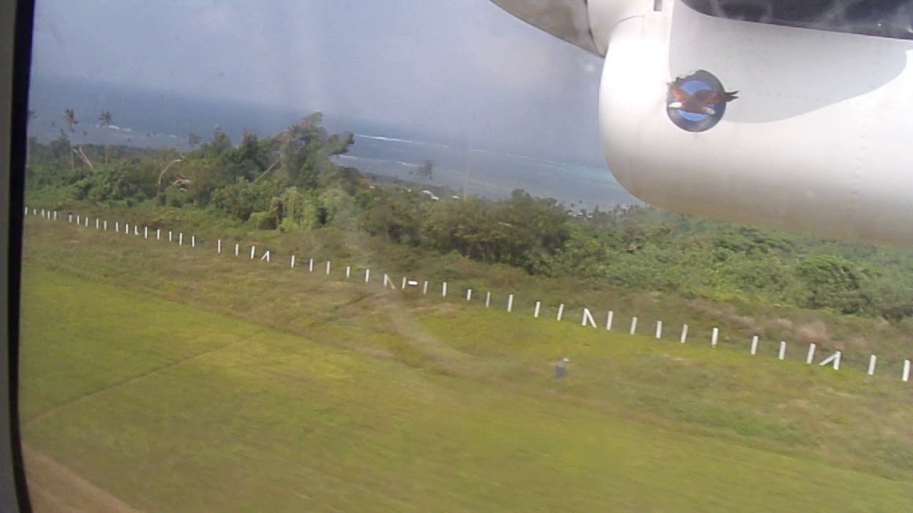 Take off from Koro Island sloped grass airfield - Fiji Link Twin Otter