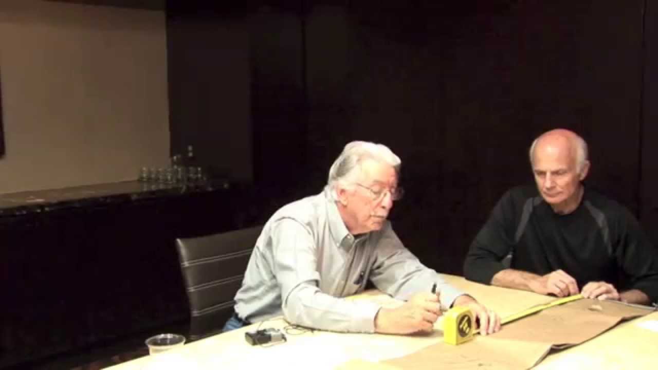 Buell Wesley Frazier demonstrates Lee Oswald's brown paper bag to Tom.