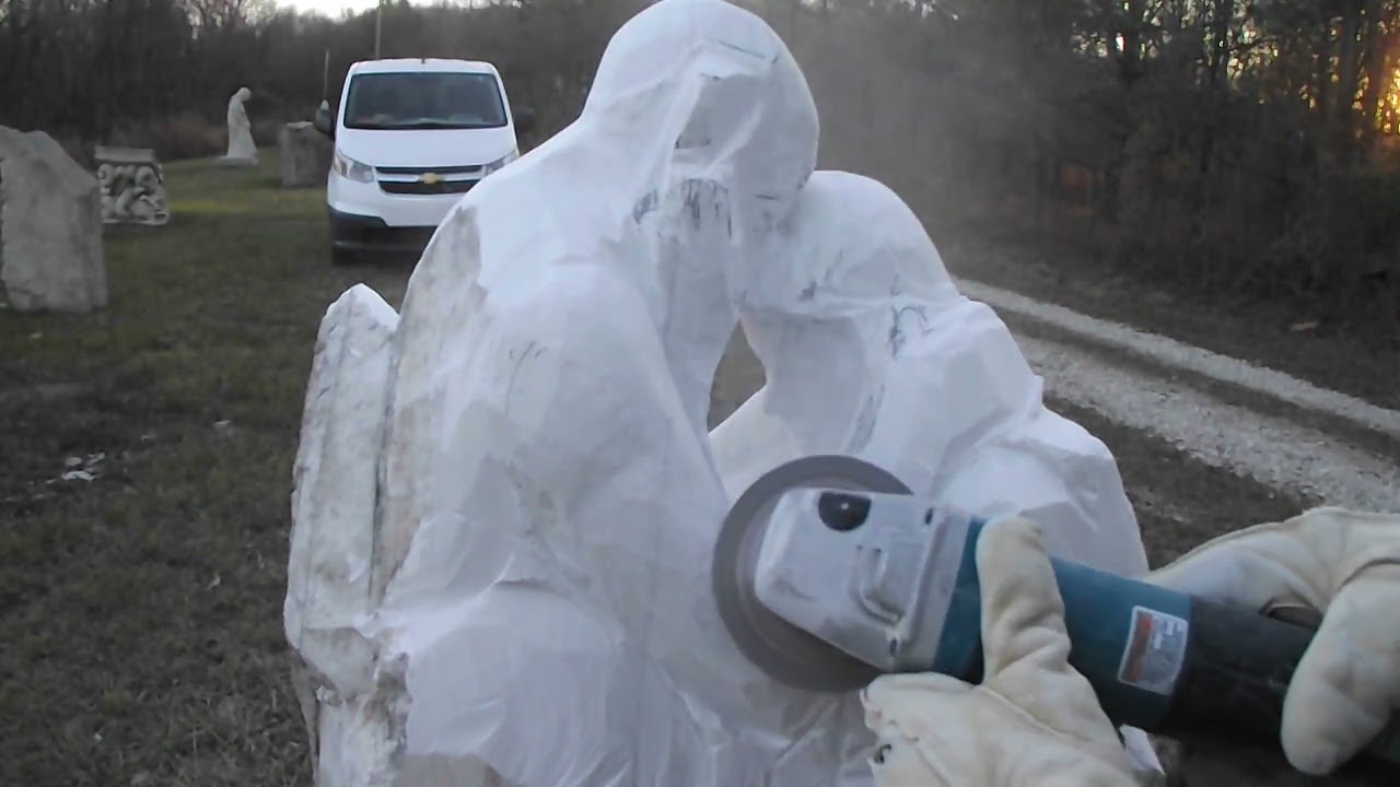 Carving Marble Together - grinding to smooth the man's arm