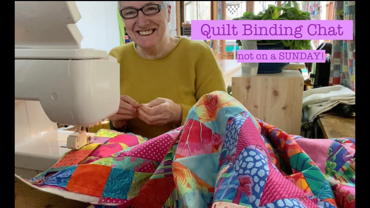 Sunday Chat on a Monday - binding the flying goose quilt with those gorgeous Kaffe Fassett fabrics