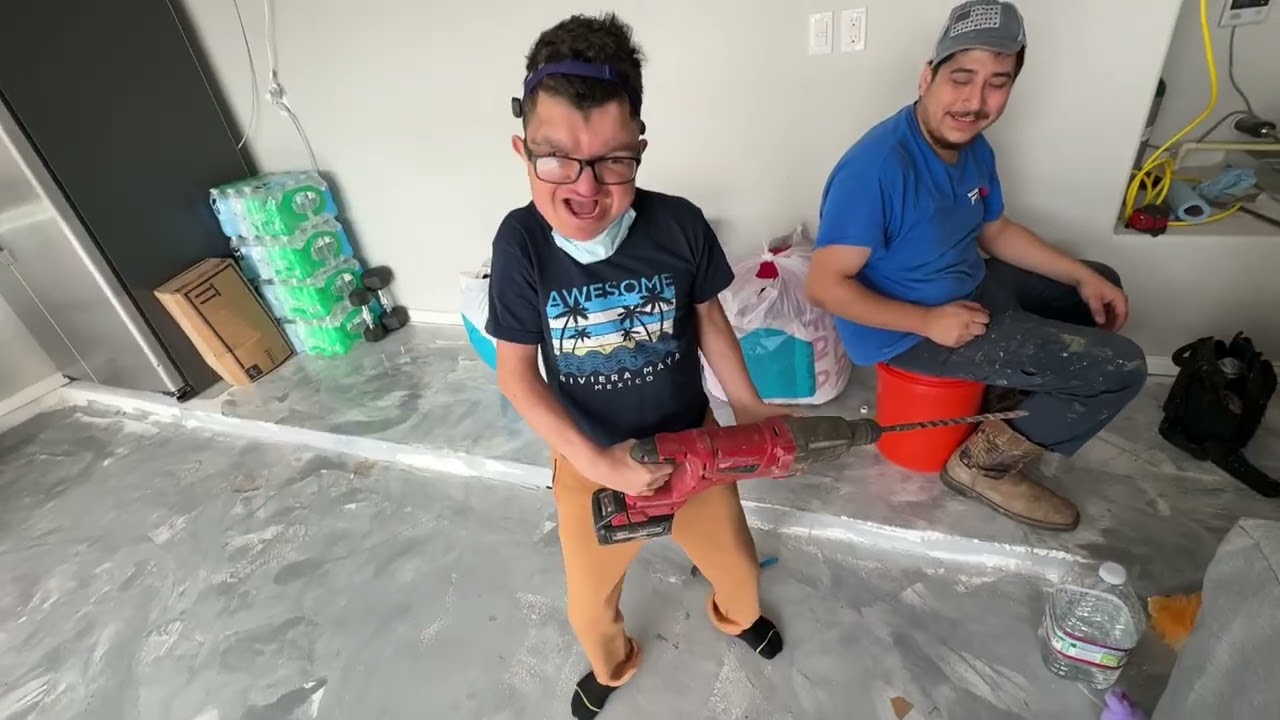 Jesse helping Fast Track Plumbing workers fix the broken pipe. 