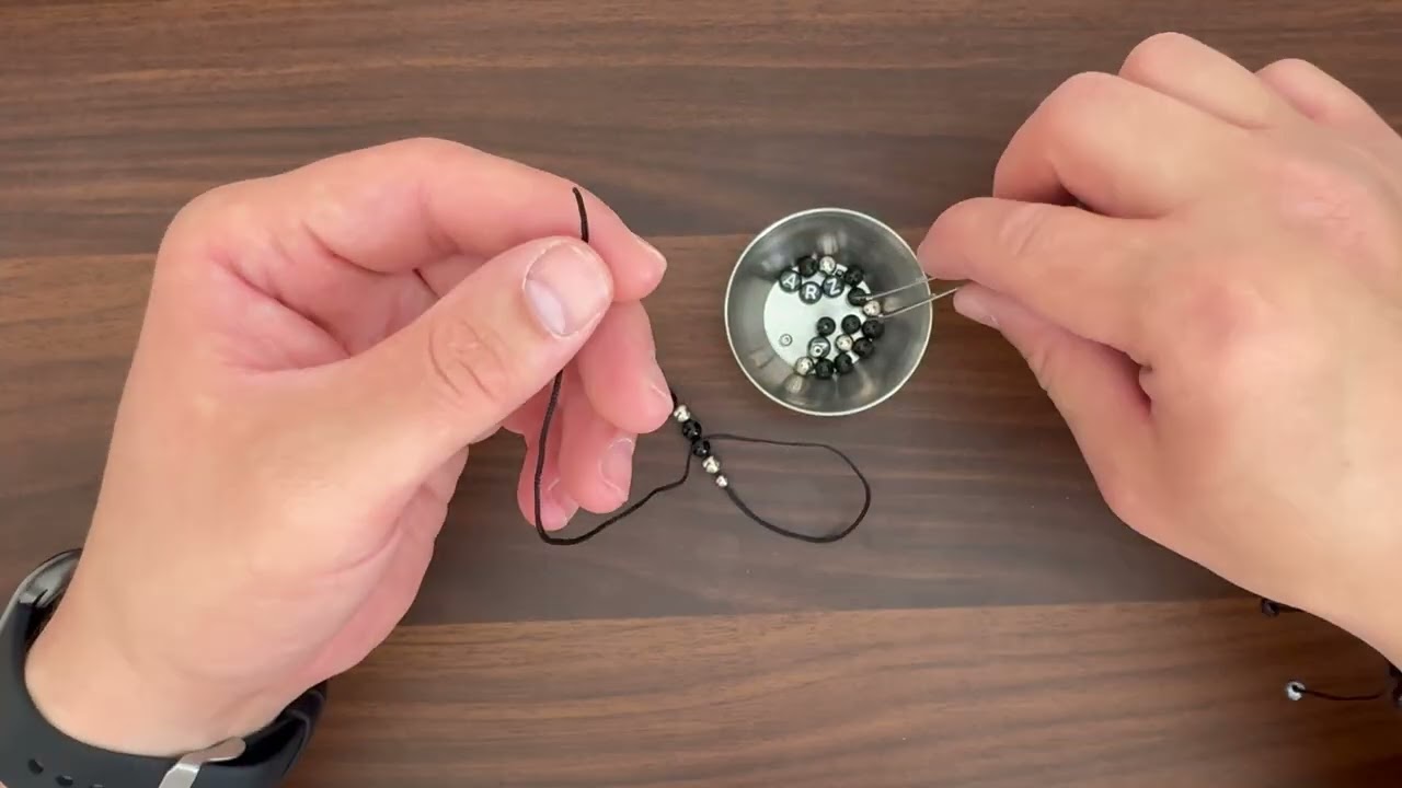 DIY Black beads bracelet with paracord end. 