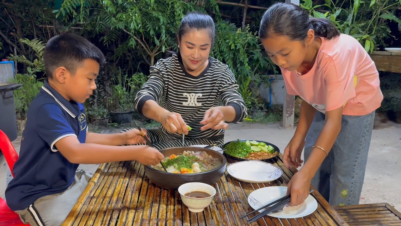 The best weather, Mother and children make hot noodle soup - Cook and eat