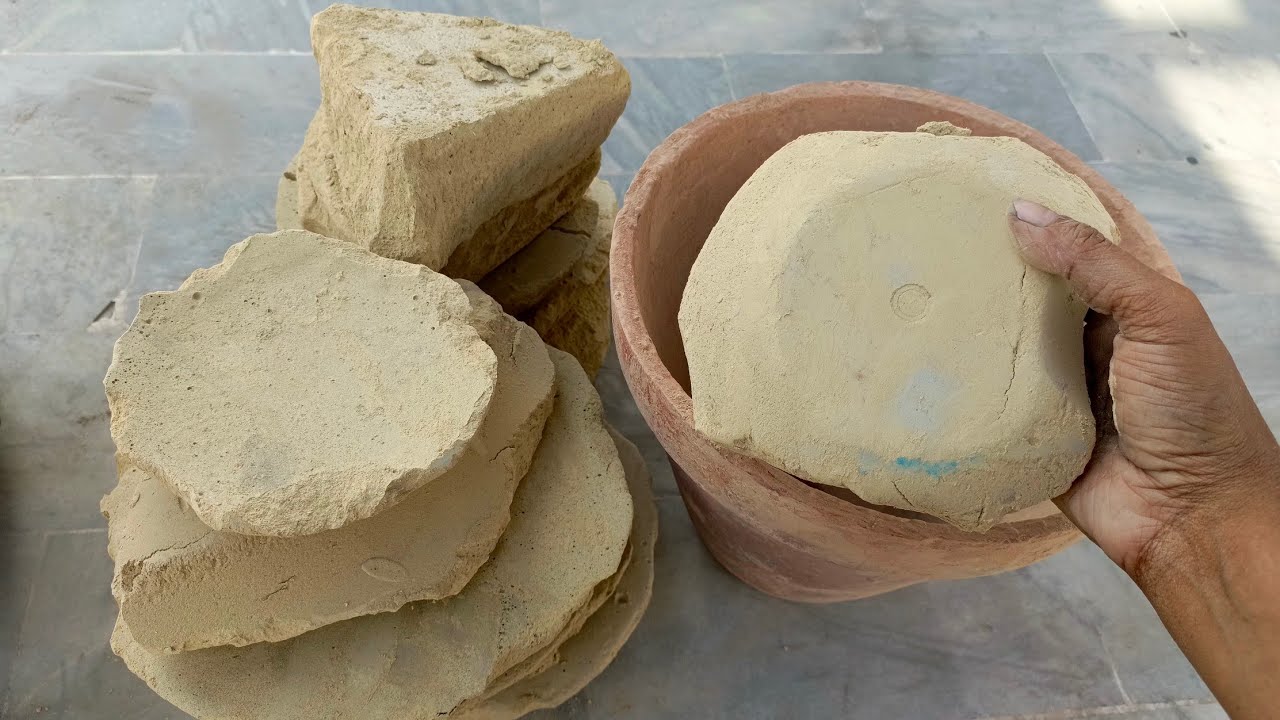 Asmr. Dry crumbling of yellow multanimitti dirt in clay pot
