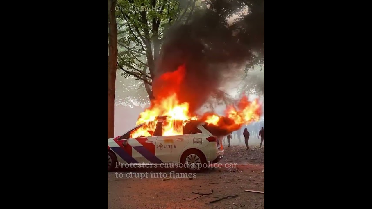 Rioters attack police in anti-migrant protests in The Hague