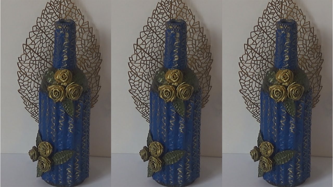 GARRAFA DECORADA COM PAPELÃO E FLORES DE EVA