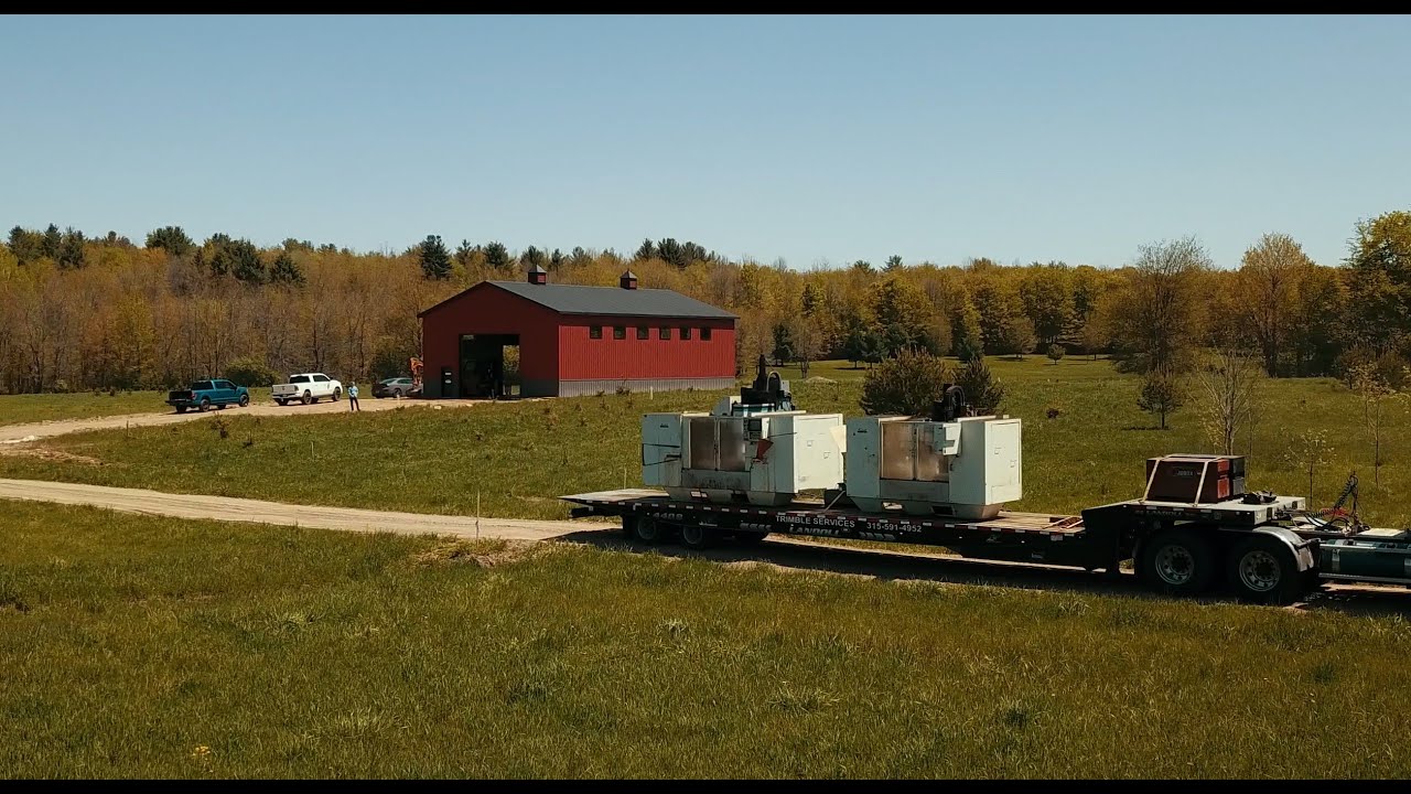 Lifting two HEAVY CNC machines on 10 day old Concrete