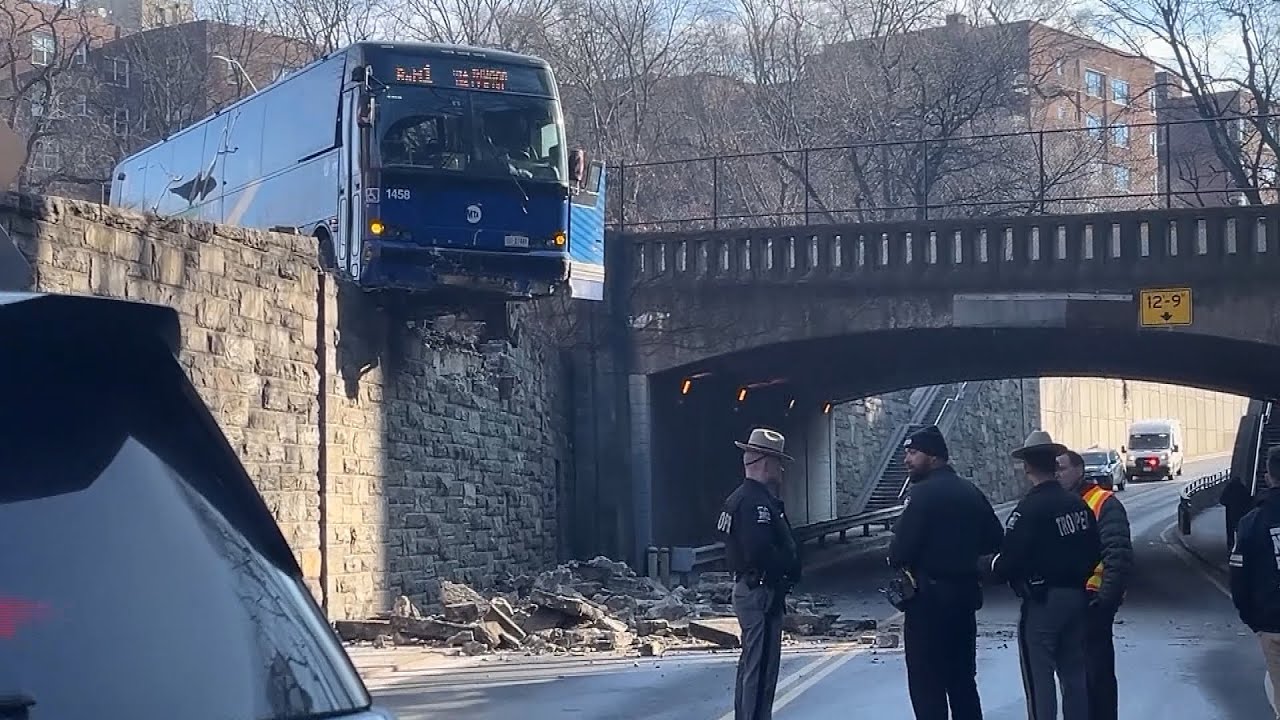 Bus Dangles From Elevated Road in New York City