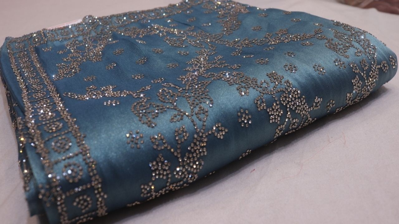 ARNG-4562: Shimmer & Shine: Turkish Blue Saree with Intricate Diamond Work on Viscose Tissue Fabric