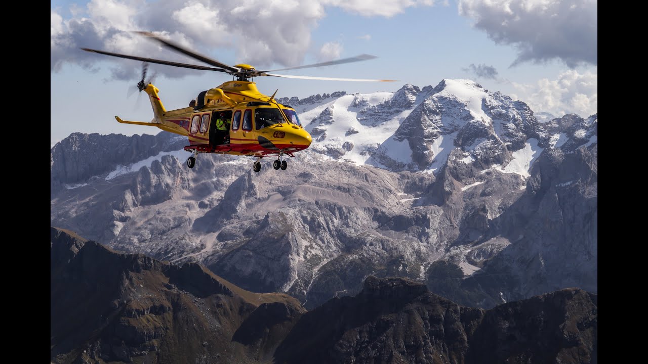 Helicopter rescue from Dolomites Italy, Piz Boe peak.