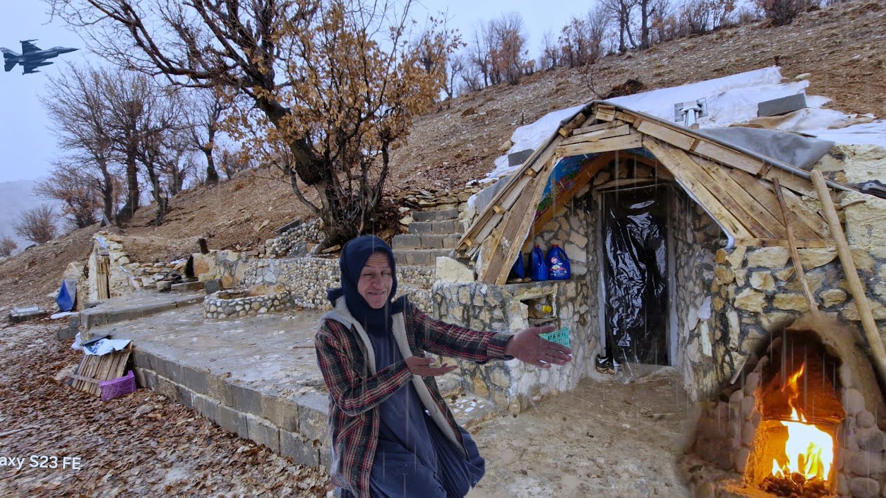 surprise rainstorm forces  cave dweller to fortify fireplace for winter survival