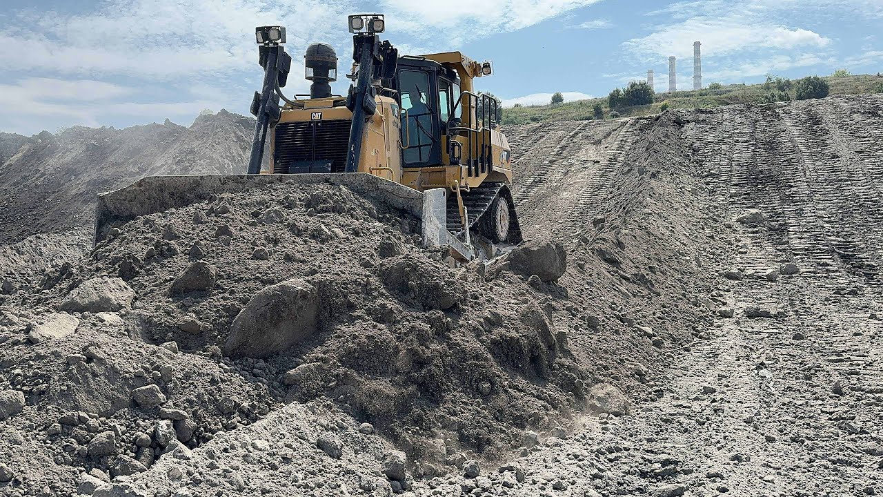Two Caterpillar D9T Bulldozers  Working For The Reclamation Of An Old Mine - Aerial View - 4K