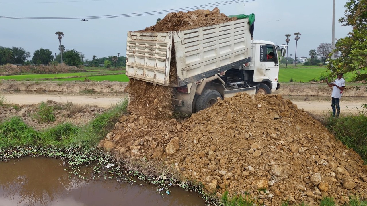 Process First JOB, Great fill flooded land using Trucks 5ton and Dozer D20P