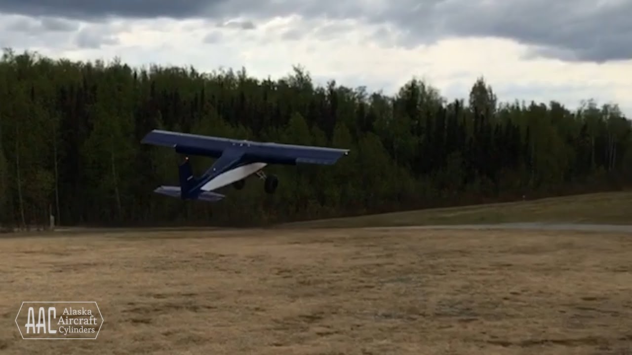 STOL Alaska bush plane taking off in front yard