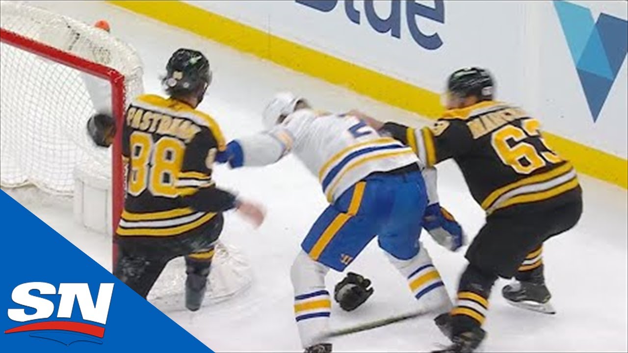 David Pastrnak & Brad Marchand Team Up On Rasmus Dahlin For Ruthless Cross Check