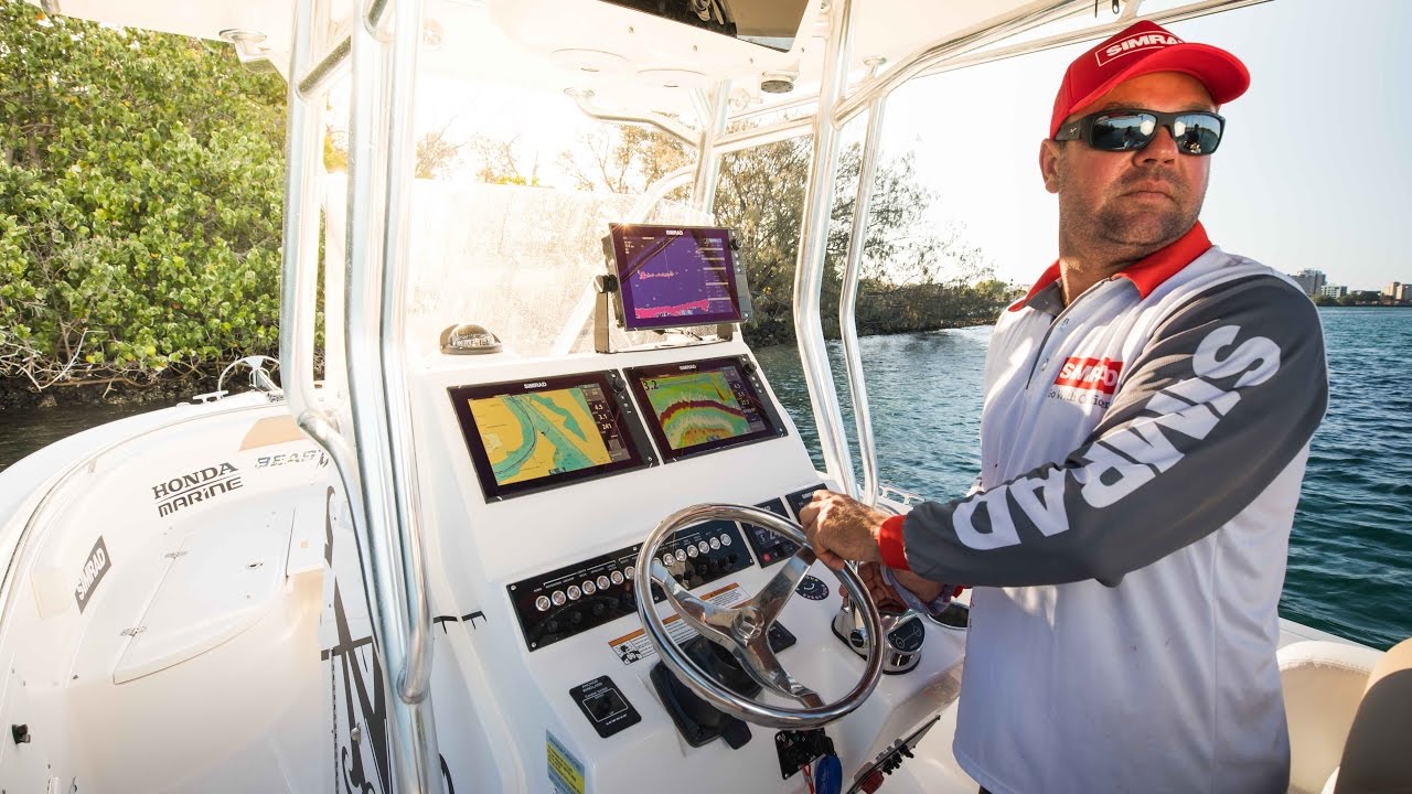 Jason Wilhelm's Edgewater 245CC with insane Simrad install.