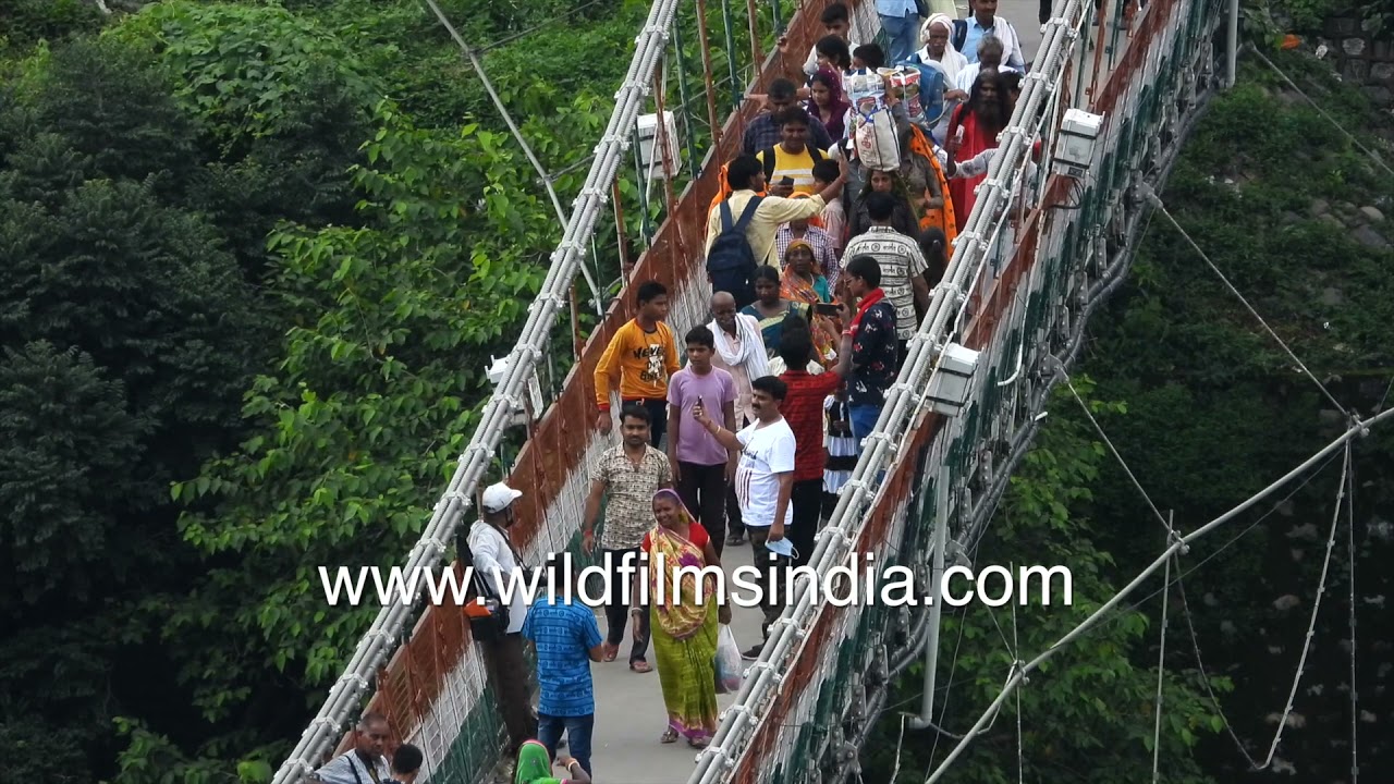 Lakshman Jhula Rishikesh full of crowds looking down to the Ganga: Covid is over?