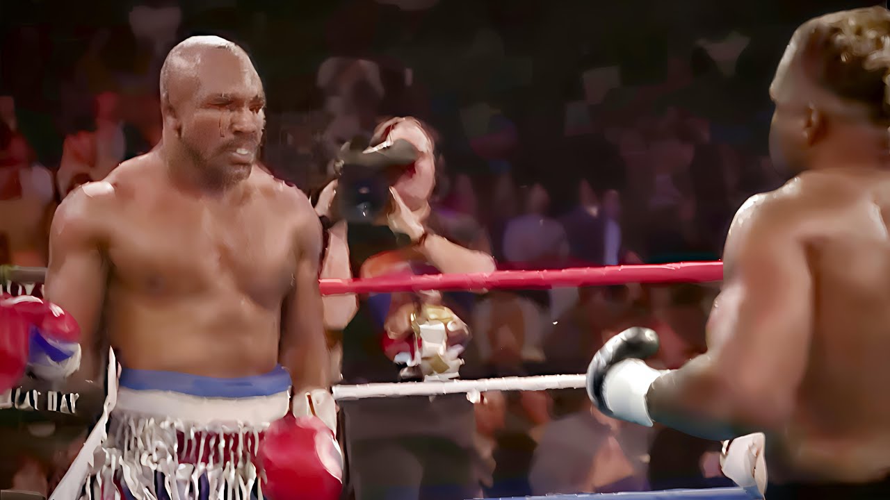 LAWAN TERKERAS ' Evander Holyfield ( babak belur Holyfield)