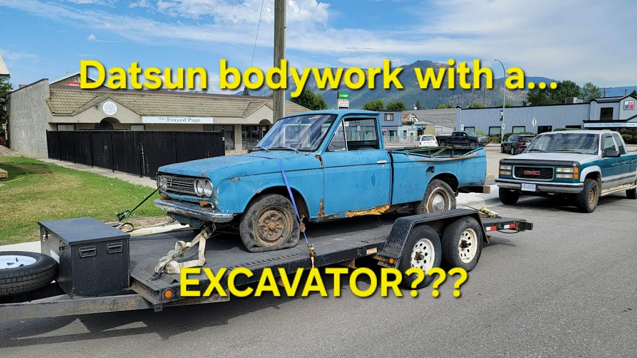 Datsun bodywork WITH AN EXCAVATOR????