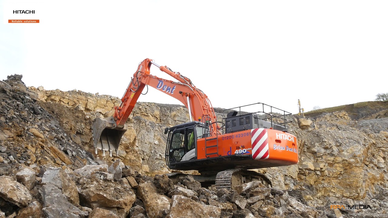 NEW Hitachi ZX490 excavating stone in a quarry.