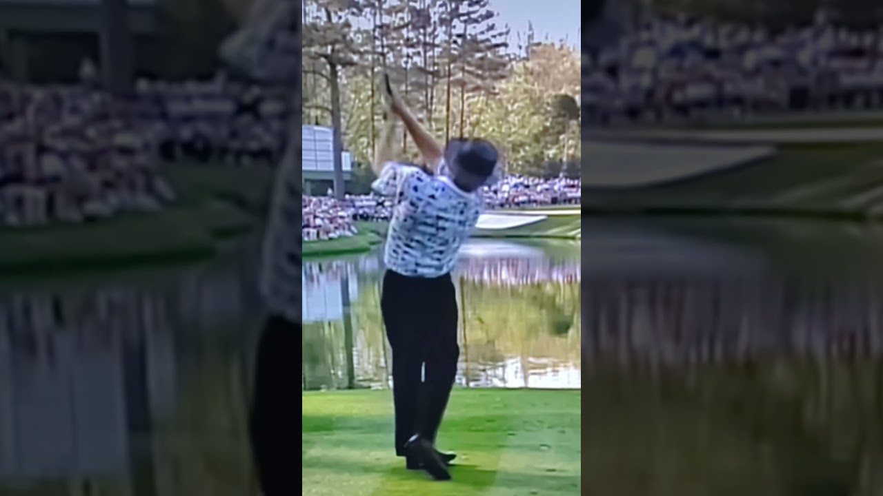 Notice how low Greg Norman moves the club in the takeaway 