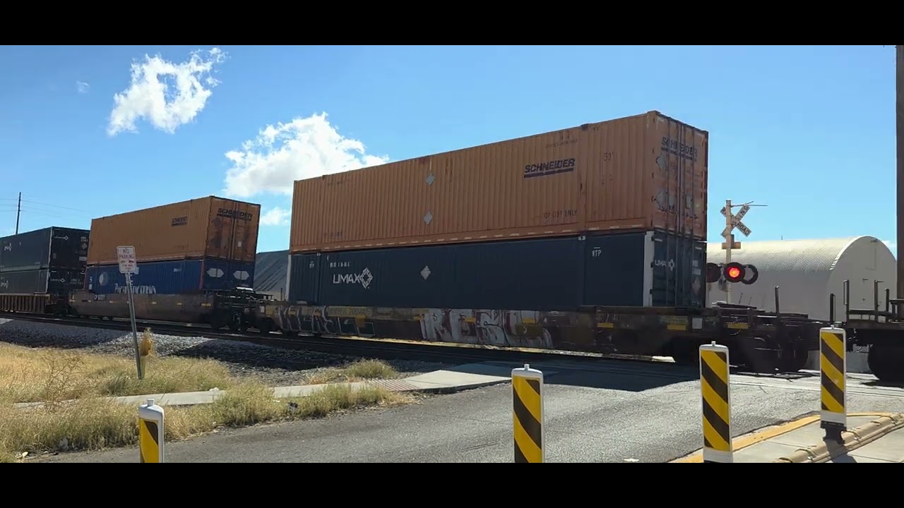 Union Pacific eastbound monster intermodal train with two mid-train DPU'S in central El Paso TX 