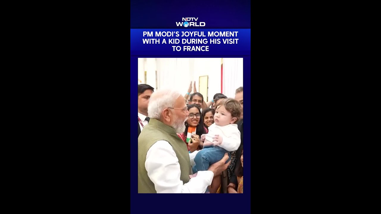 PM Modi's Joyful Moment With A Kid As The Indian Diaspora Welcomes Him In France