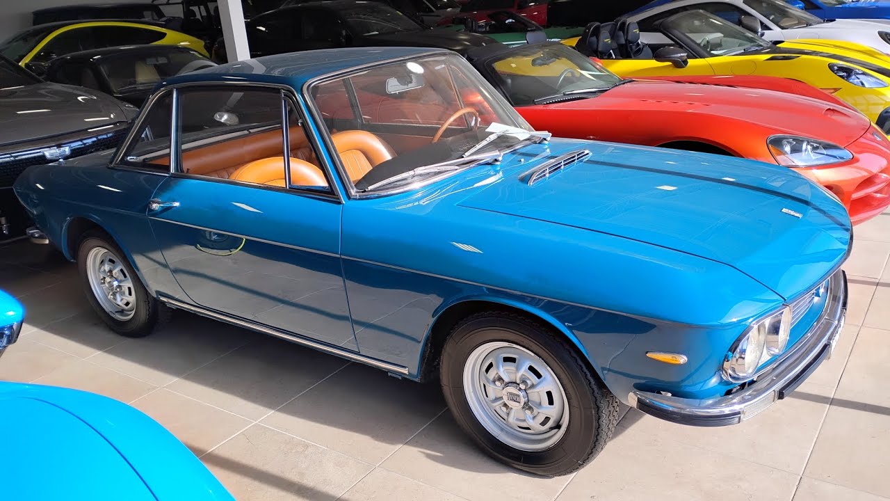 This is a 1967 Lancia Fulvia Coupe and it's at Ogden Lincoln in Westmont, Illinois.