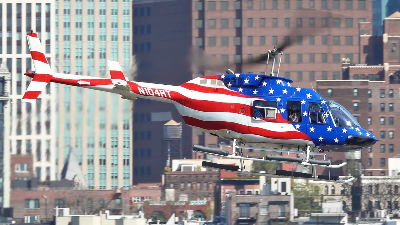 Bell 206 L-3 Long Ranger III helicopter landing & take off at New York Manhattan heliport KJRB