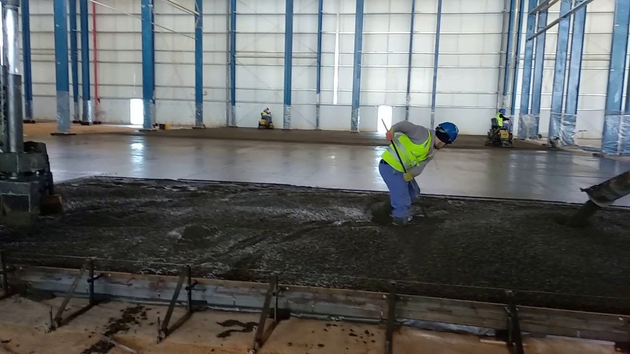 Casting of slab on grade with laser screed machine.