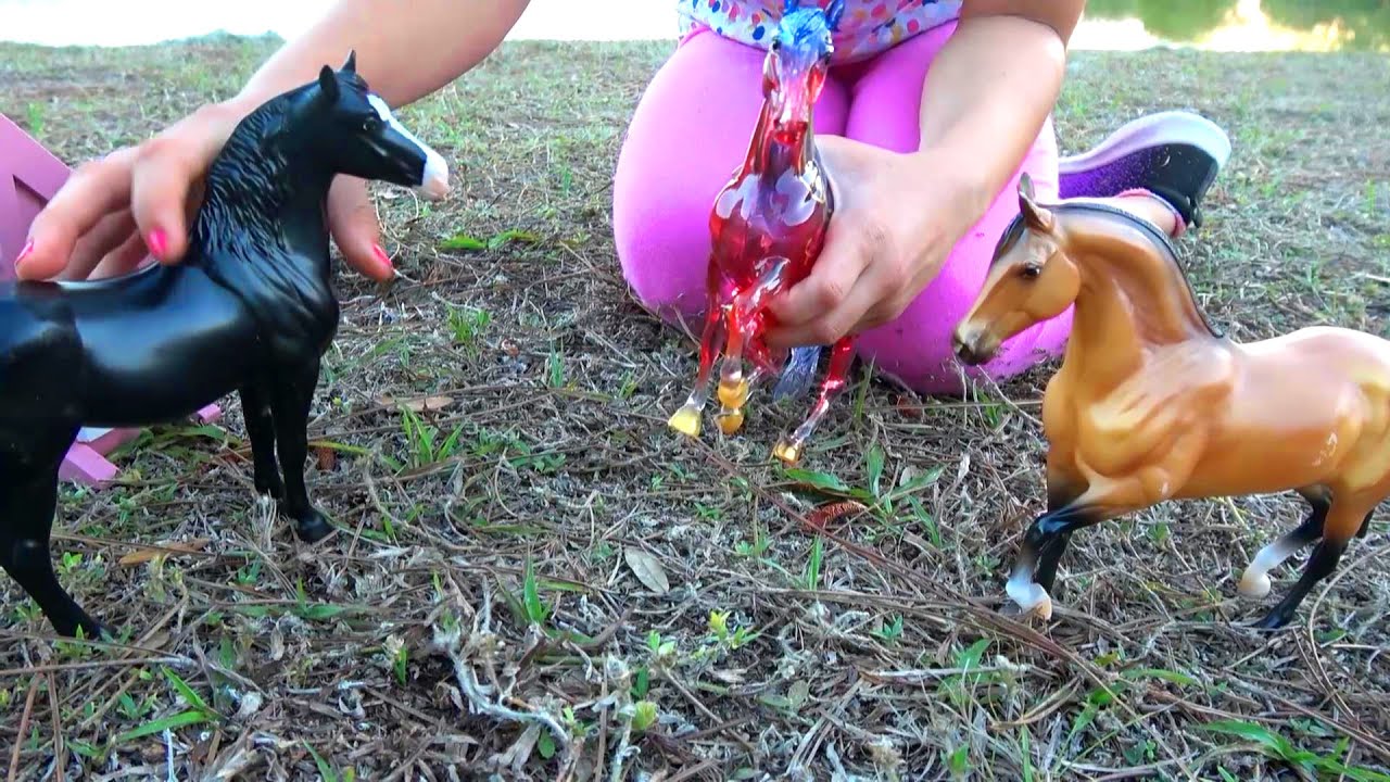Toy horses in park - playing