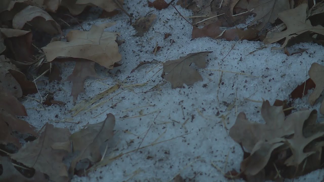 Man rescues woman trapped in snow-covered ditch