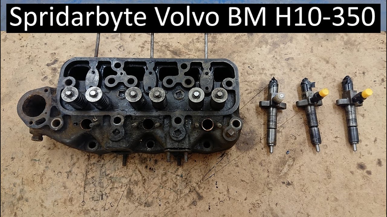 Byter spridare på baklastaren Volvo BM H10-350