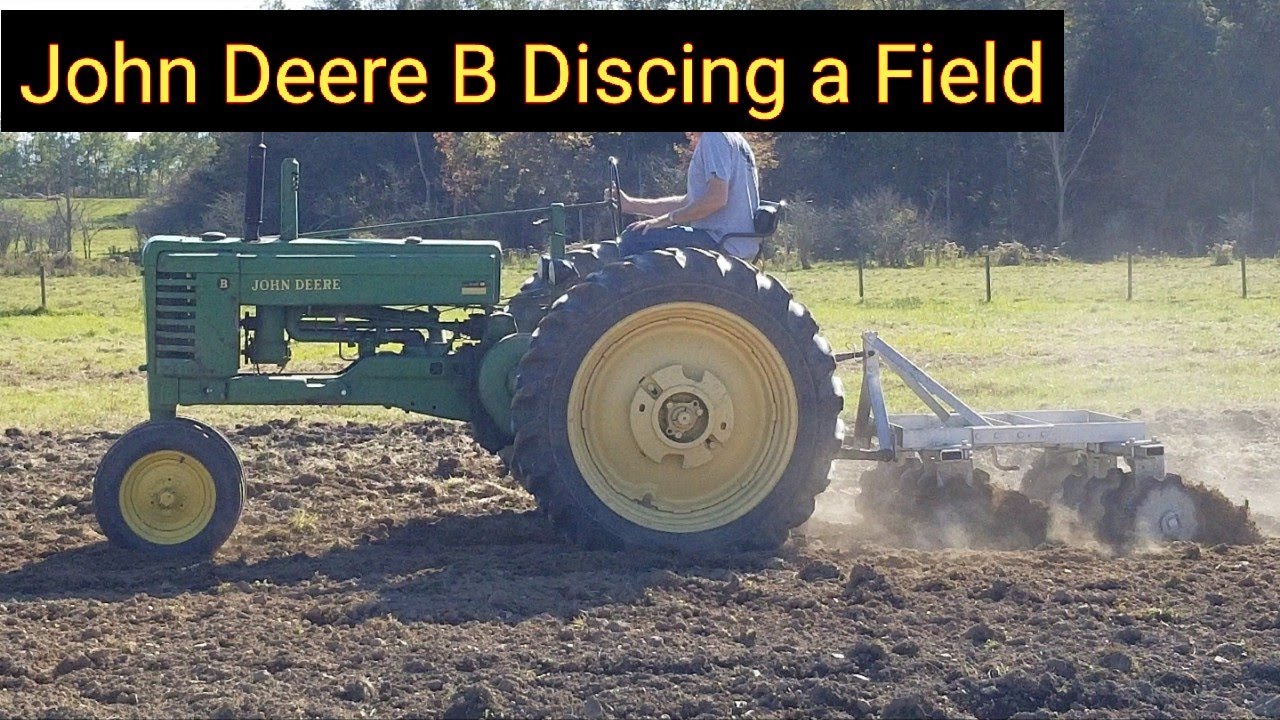 John Deere B Discing a Field