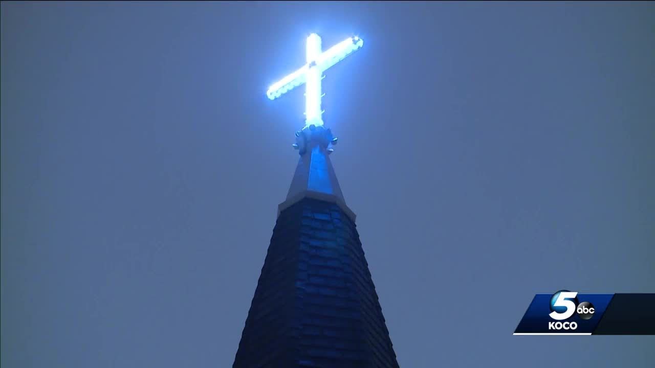 Cross at Oklahoma City cathedral illuminates night sky