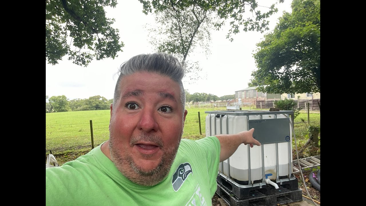 Using my new Bosch 18V Water Pump to empty my waterbutt in to my IBC tank at the top of my garden