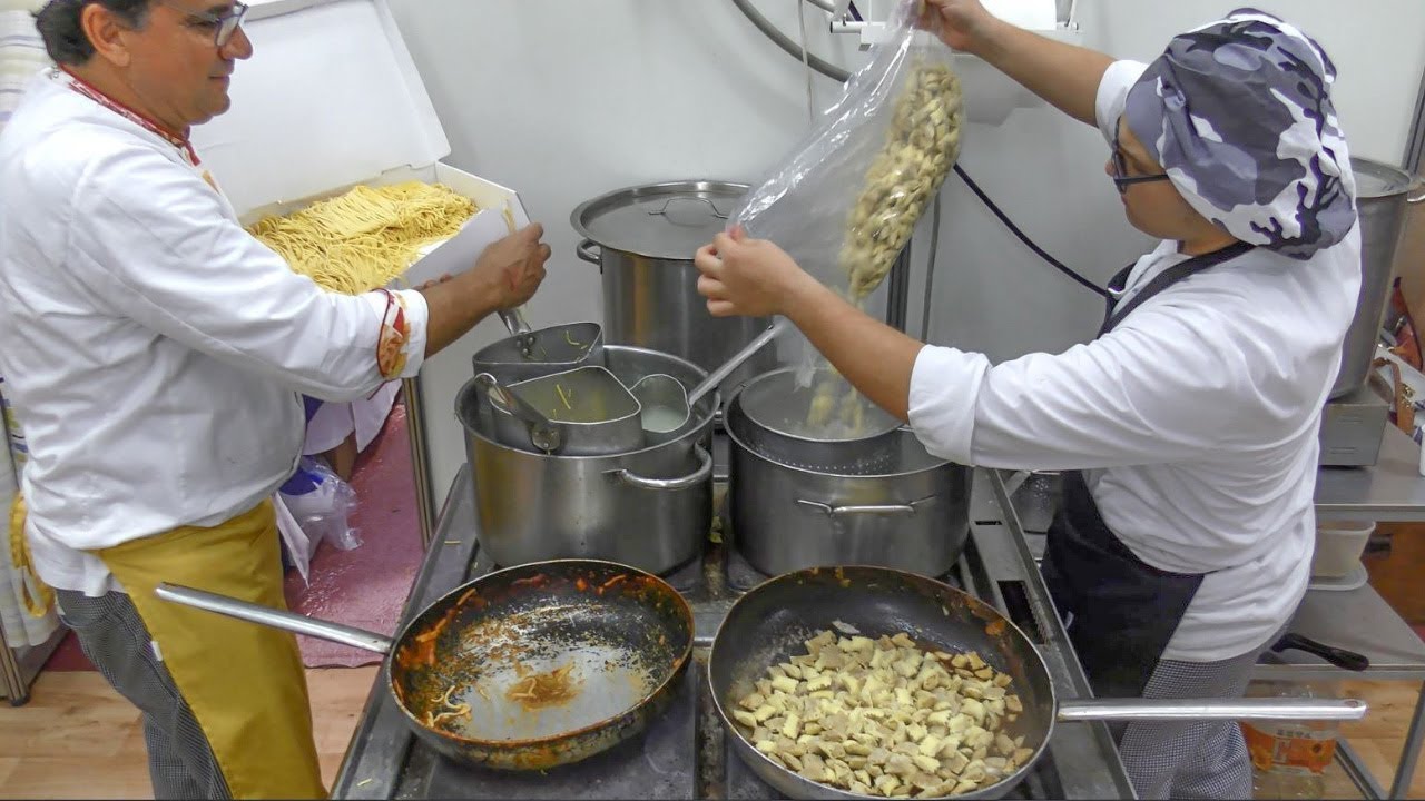Yummy Italian Pasta and Dumplings with Peppers. Italy Street Food
