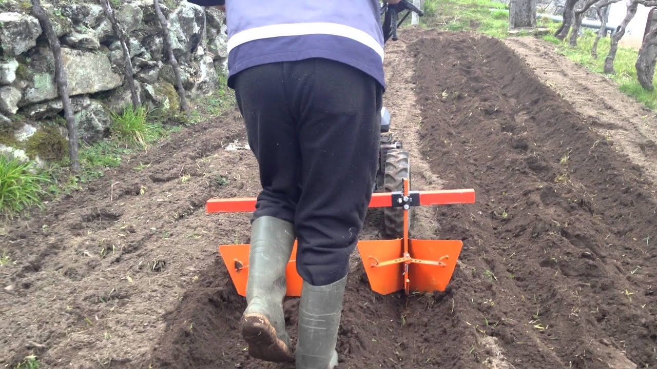 doble abre riegos motocultor