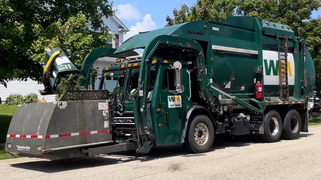 WM Mack LEU McNeilus Contender Curotto Can Garbage Truck on Yard Waste