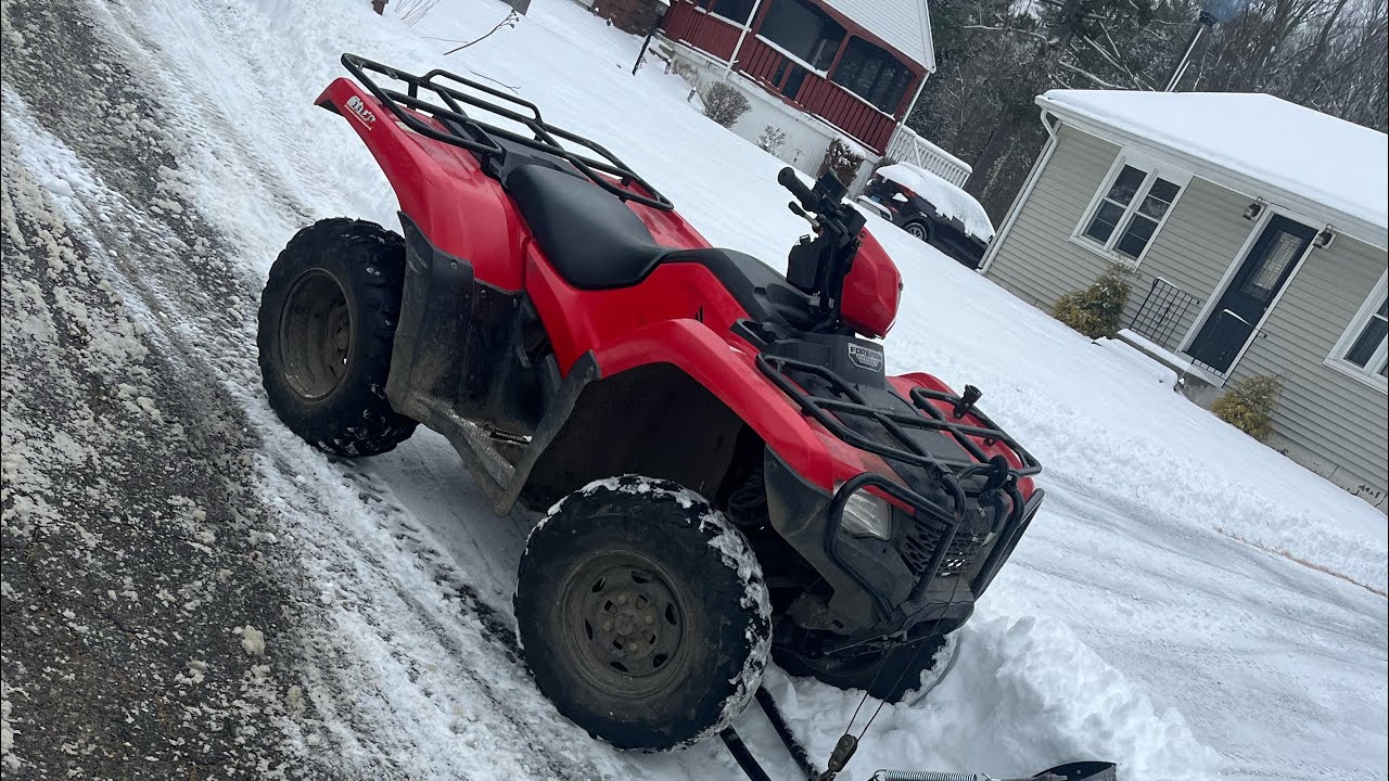 Honda foreman 500 plowing snow 