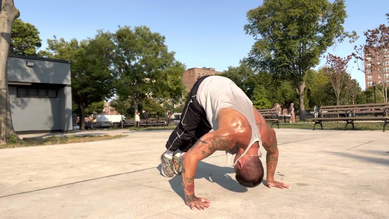 Wide grip pike pushups
