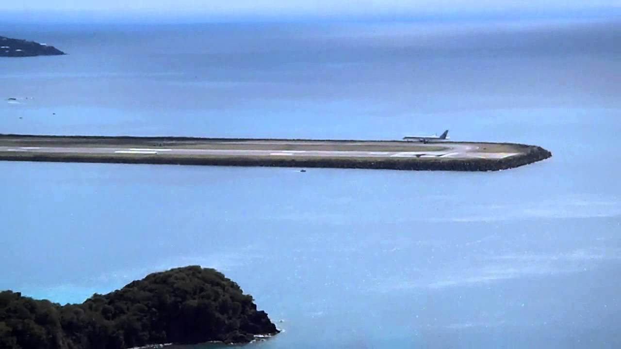 Crazy view of a passenger jet landing at St. Thomas