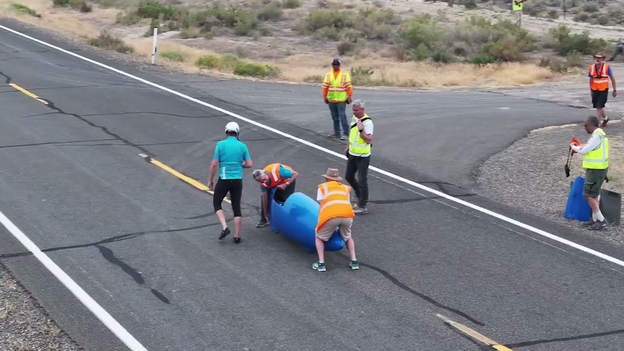 Russell in Nevada desert riding Blue 77 bicycle over 70 miles/h