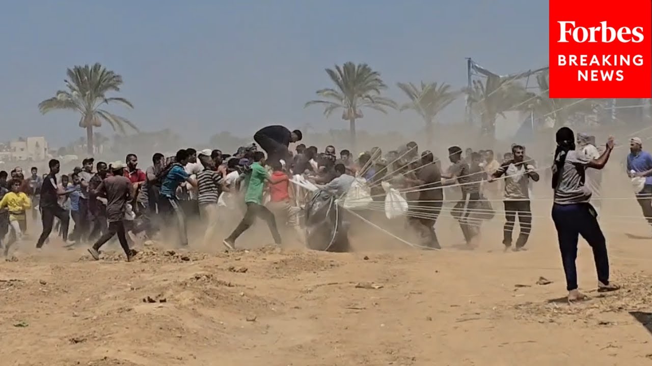 Palestinians Rush To Humanitarian Aid Airdropped Into Gaza