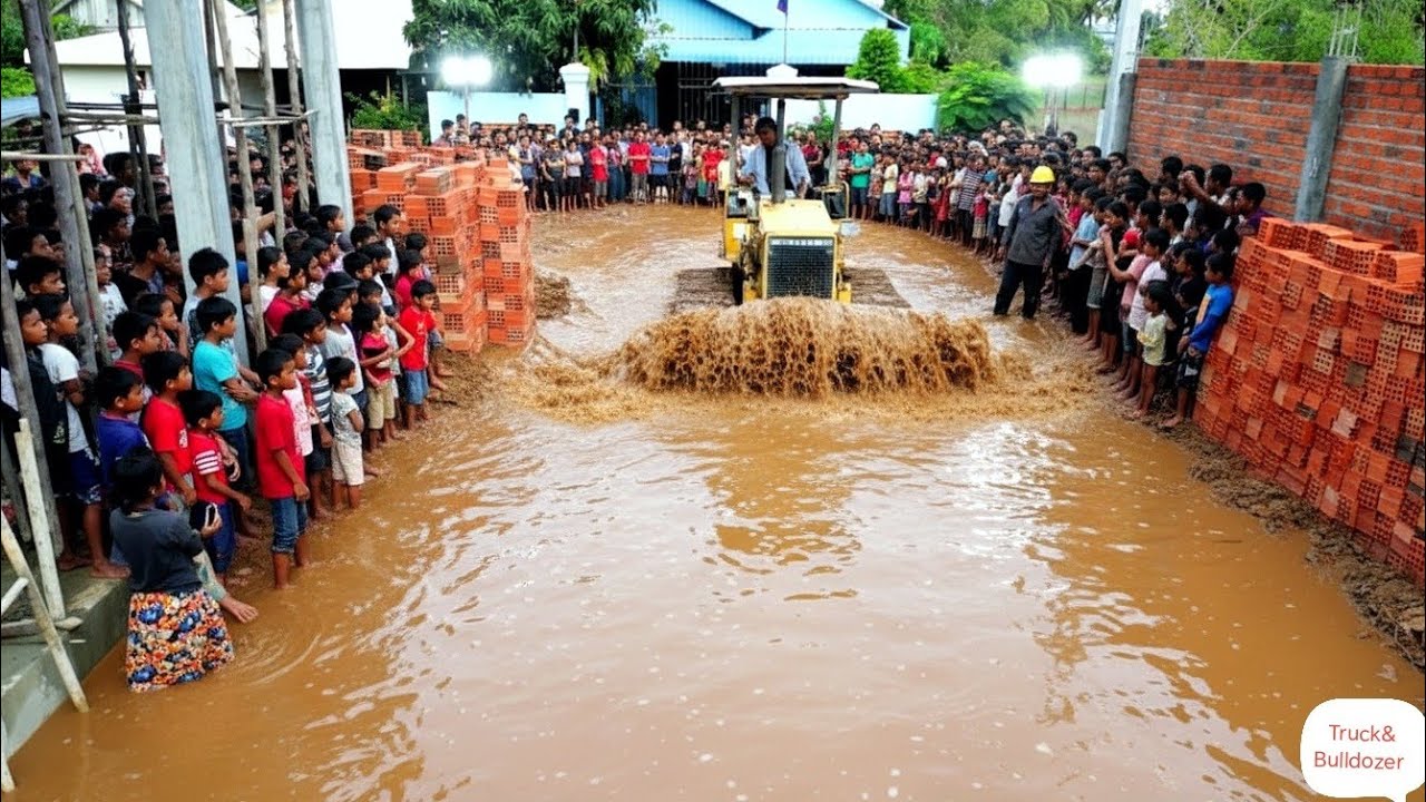 Complete Construction Road By Skill Bulldozer Pushing And 5 Ton Dump Truck Unloading Red Pebbles