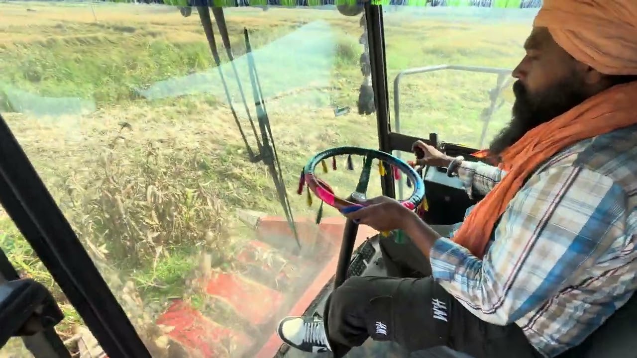 Cabin view of New holland Ac harvester in maize 
